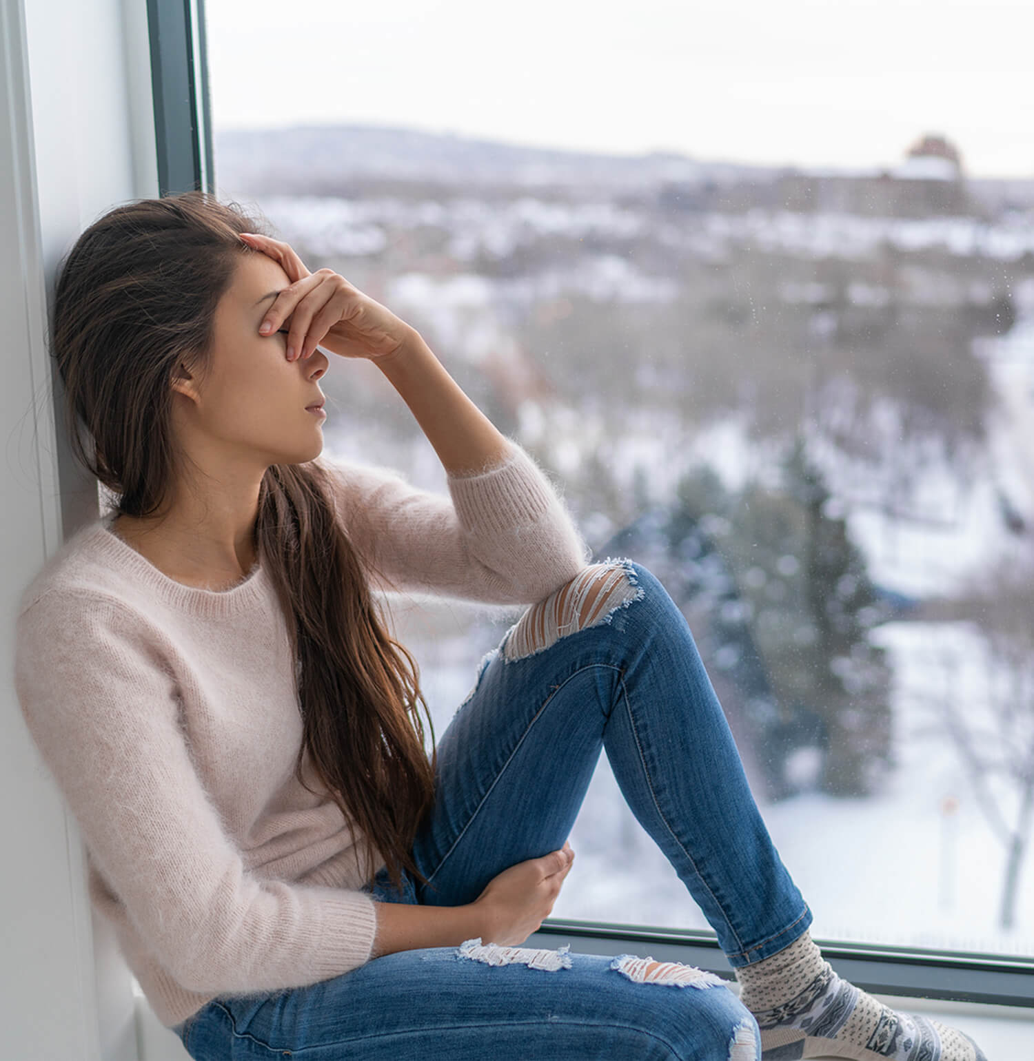 Woman sitting in window with hand over eyes. Dealing with separation anxiety, GAD, social anxiety, or any type is challenging. If it is affecting your day to day flow, talk with an anxiety therapist who uses psychotherapy to help. Call now and begin anxiety treatment in Torrance, CA and surrounding areas soon!