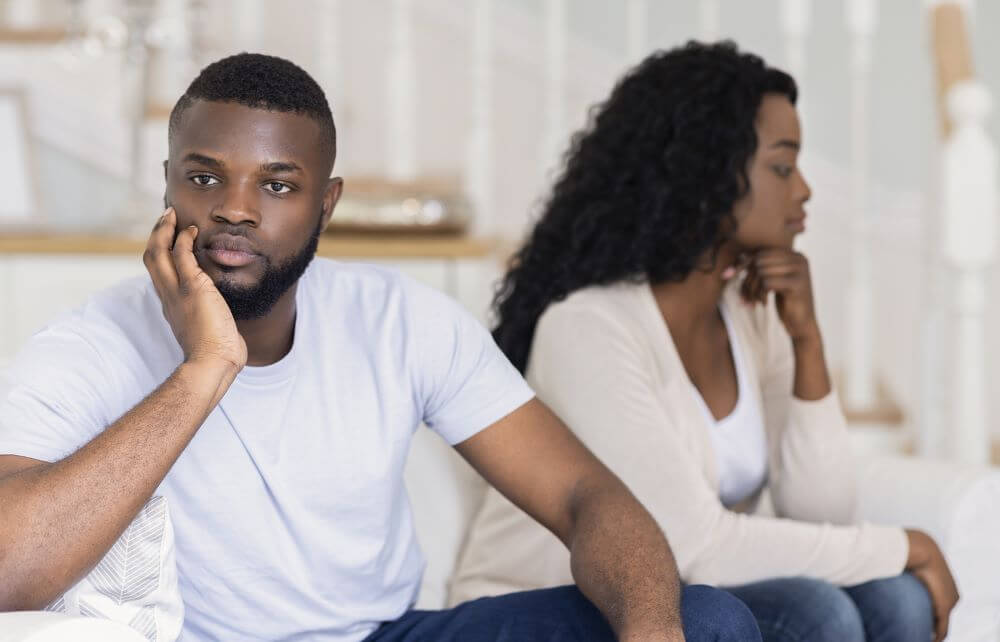 Black couple sitting on couch not talking. Beginning marriage counseling and couples therapy in Torrance, CA can help you communicate hurt feelings or areas where improvement is needed. If you need support, Dr. Carol, an EFT therapist can help. Call now for EFT therapy and couples therapy today!